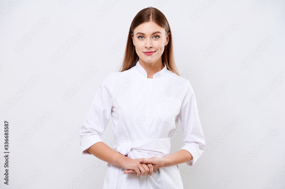 Young nurse looking at the camera on white isolated background. Corona Virus Pandemic concept Young nurse looking at the camera on white isolated background. Corona Virus Pandemic concept