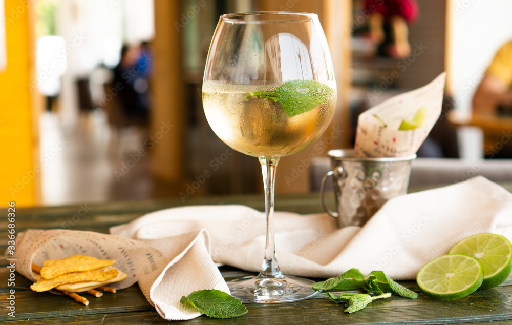 a glass of Lemoncello on the black table a glass of Lemoncello on the black table