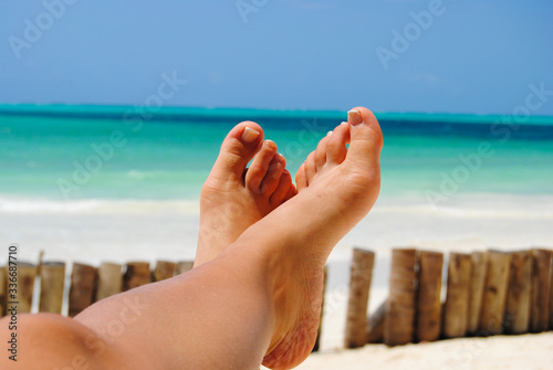 woman feet on the beach
