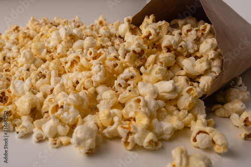 Heap of delicious popcorn on the white background.