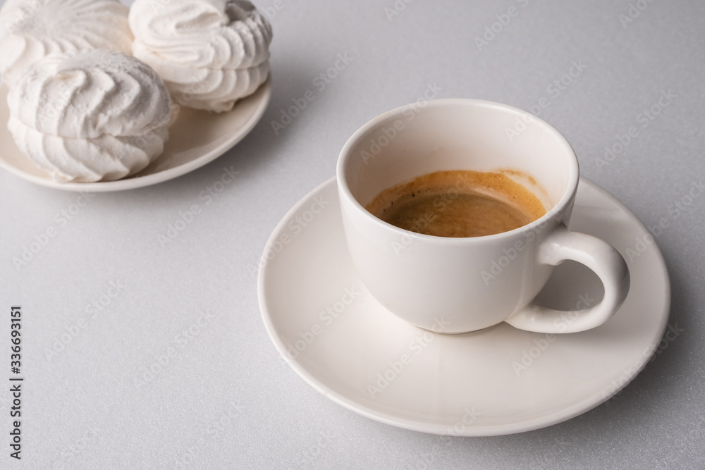 .?offee and white marshmallows on a white background .?offee and white marshmallows on a white background