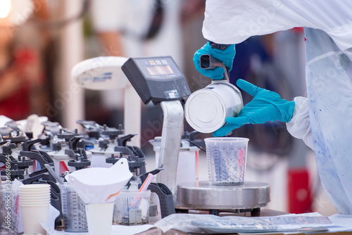 Wall Mural Preparation of paint for car paint in the laboratory, the car paint shop in the factory, and the training of craftsmen in color mixing