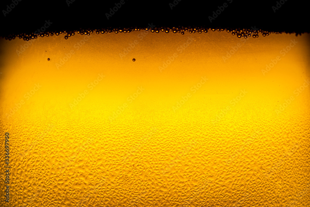 Beer bubbles, macro view,Close up background of beer with bubbles in glass 