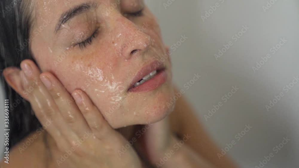sad woman showering relaxing from a stressful day in slowmotion
sad woman showering relaxing from a stressful day in slowmotion