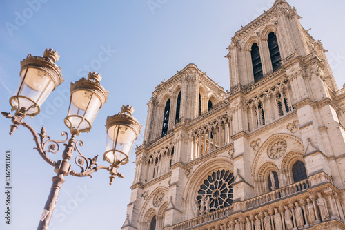 the facade of Notre-Dame Cathedral, a medieval Cathedral Church in Paris, France.