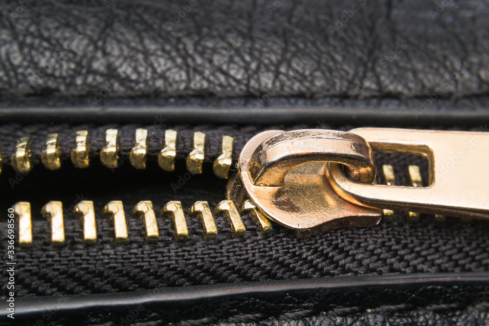 close-up photo of a metllic zipper close-up photo of a metllic zipper