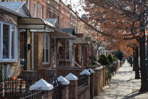 Photography A Row of Old Brick Homes along the Sidewalk in Astoria Queens of New York City