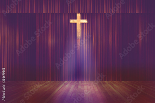 wooden cross on red curtain background in small church