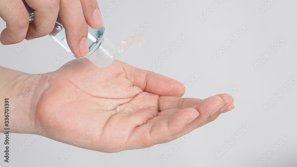 Hands is squeezing alcohol hand gel on white background. Hands is squeezing alcohol hand gel on white background.