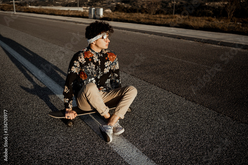 Portrait Guy with style and modern with a longboard in the street © Rafa