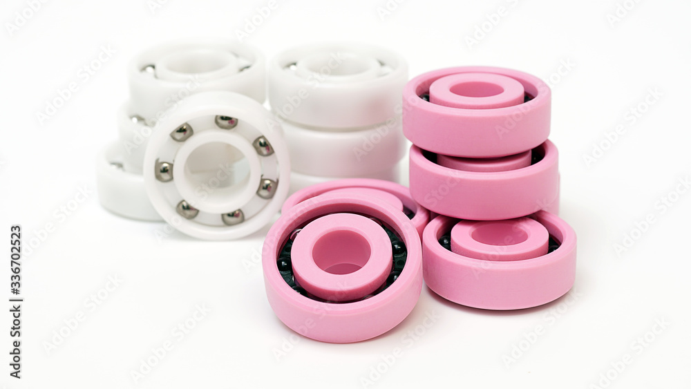 White and pink plastic Ball bearing On a white background. White and pink plastic Ball bearing On a white background.