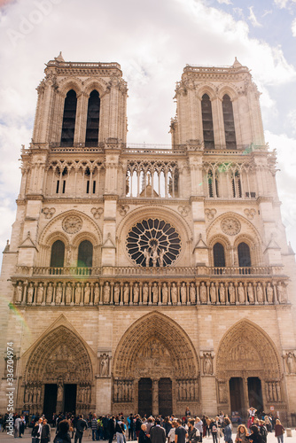 the facade of Notre-Dame Cathedral, a medieval Cathedral Church in Paris, France. © Aleksei Zakharov