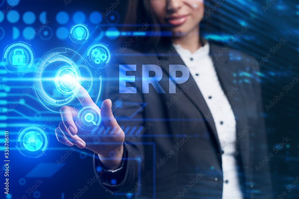 Business, Technology, Internet and network concept. Young businessman working on a virtual screen of the future and sees the inscription: ERP Business, Technology, Internet and network concept. Young businessman working on a virtual screen of the future and sees the inscription: ERP