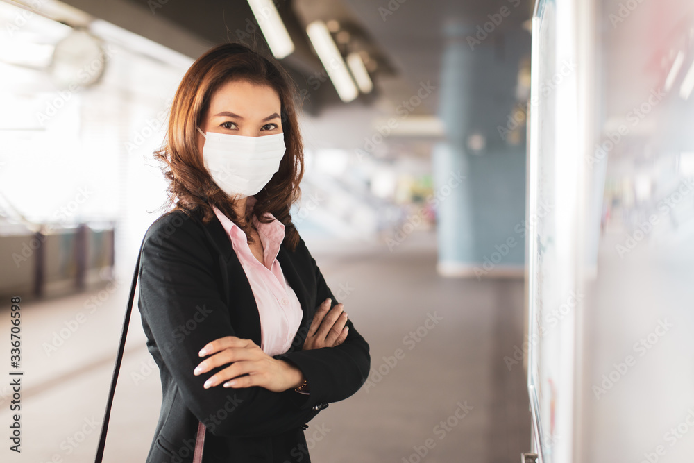 Woman wearing mask reading map. Woman wearing mask reading map.