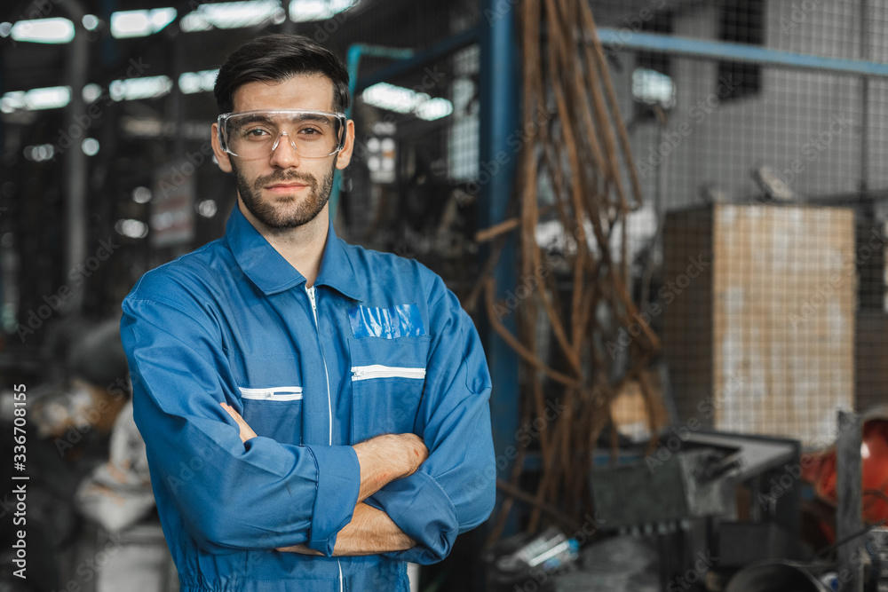 portrait image engineer men wearing uniform safety in factory background. portrait image engineer men wearing uniform safety in factory background.
