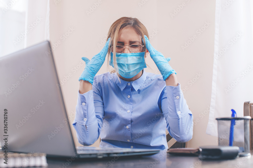 woman with laptop. COVID-19. Virus. Depression. Work. Working. woman with laptop. COVID-19. Virus. Depression. Work. Working.