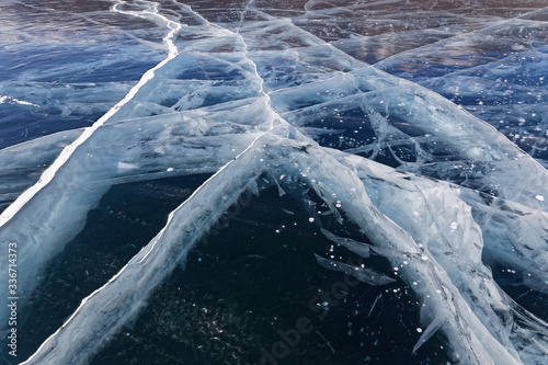 Natural patterns on the ice and the snow of the Khovsgol lake in winter photo
