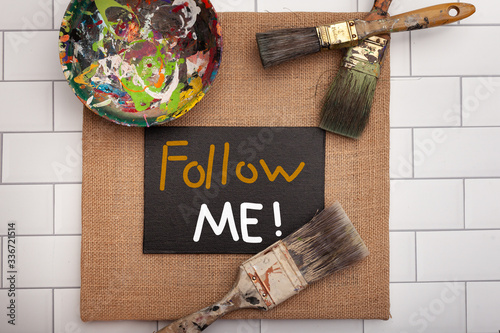 Cuadro en lienzo Social media hand-painted sign with Follow Me! message framed with art paint bru