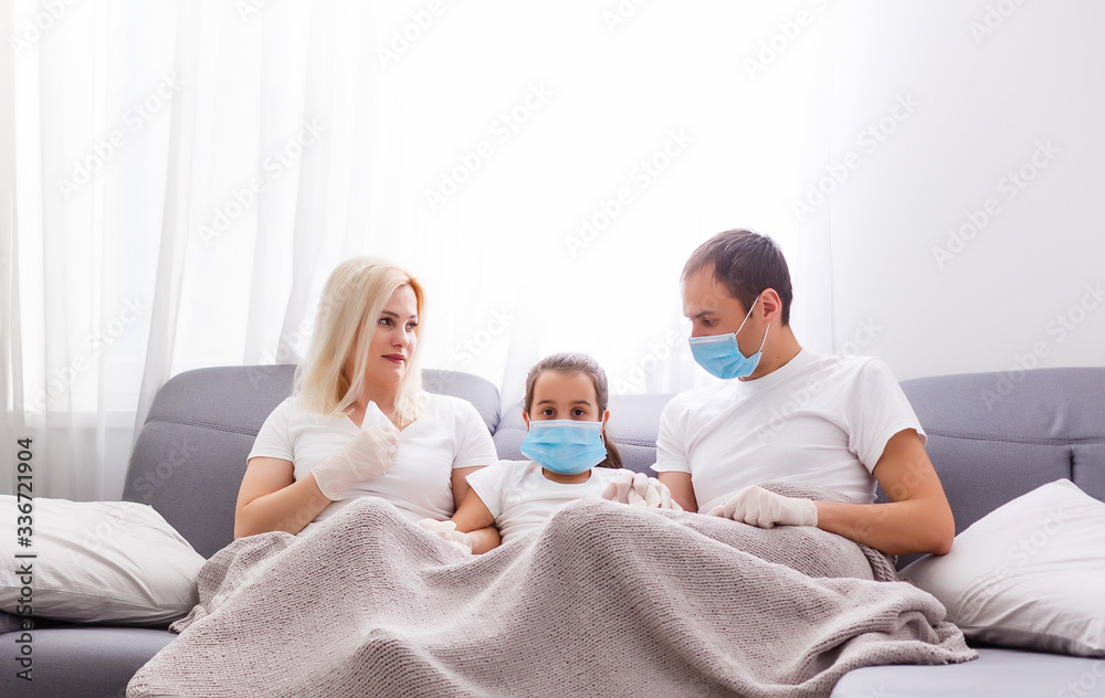Obraz premium Ill family sitting on sofa at home