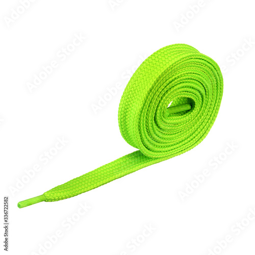 Zielona sznurówka zwinięta w rulon.