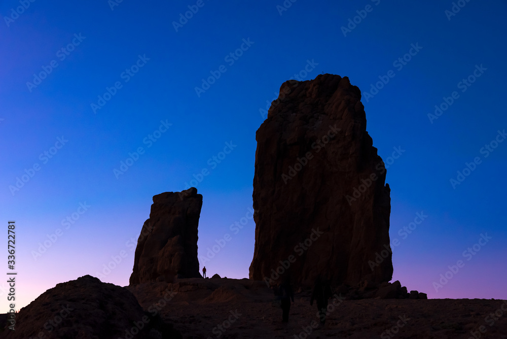a silhouette of roque nublo at dusk in the gran canaria island