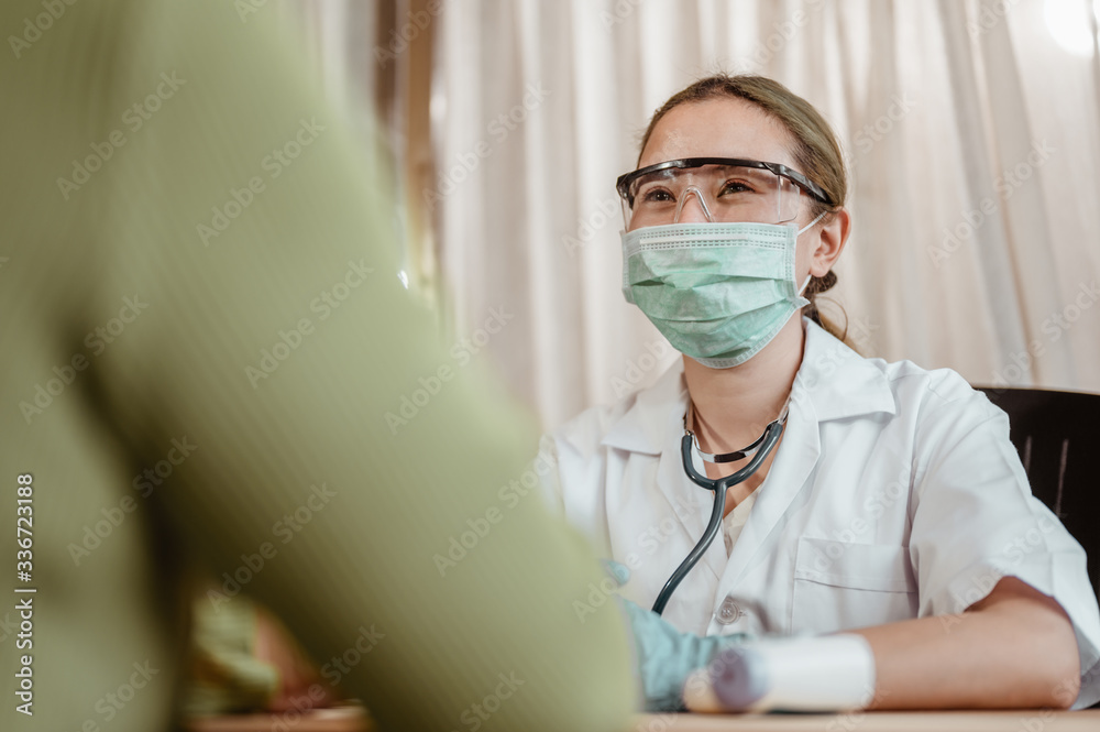 Doctor consultation about viral fever with patient at hospital. Coronavirus, covid-19, Work from home, Social distancing, Quarantine, Prevent infection concept. Doctor consultation about viral fever with patient at hospital. Coronavirus, covid-19, Work from home, Social distancing, Quarantine, Prevent infection concept.