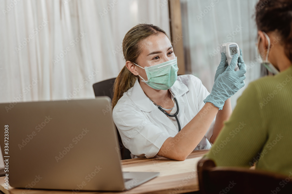 Doctor consultation about viral fever with patient at hospital. Coronavirus, covid-19, Work from home, Social distancing, Quarantine, Prevent infection concept.