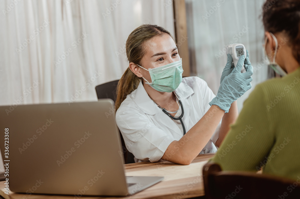Doctor consultation about viral fever with patient at hospital. Coronavirus, covid-19, Work from home, Social distancing, Quarantine, Prevent infection concept. Doctor consultation about viral fever with patient at hospital. Coronavirus, covid-19, Work from home, Social distancing, Quarantine, Prevent infection concept.