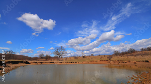 Beautiful Landscape with Cumulus Cloud above the lake