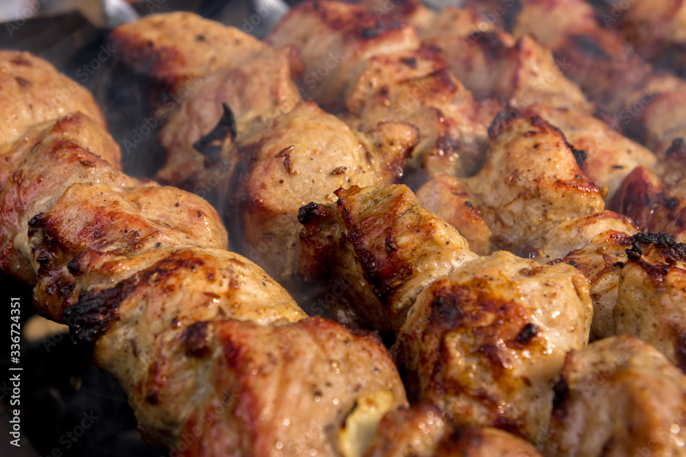 Nice, tasty, closeup grilled meat shashlik with a golden crust. 