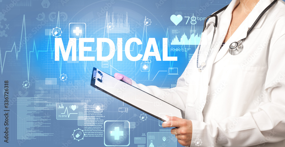 young doctor writing down notes with MEDICAL inscription, healthcare concept young doctor writing down notes with MEDICAL inscription, healthcare concept