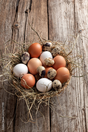 Hen and quail eggs in a wicker basket