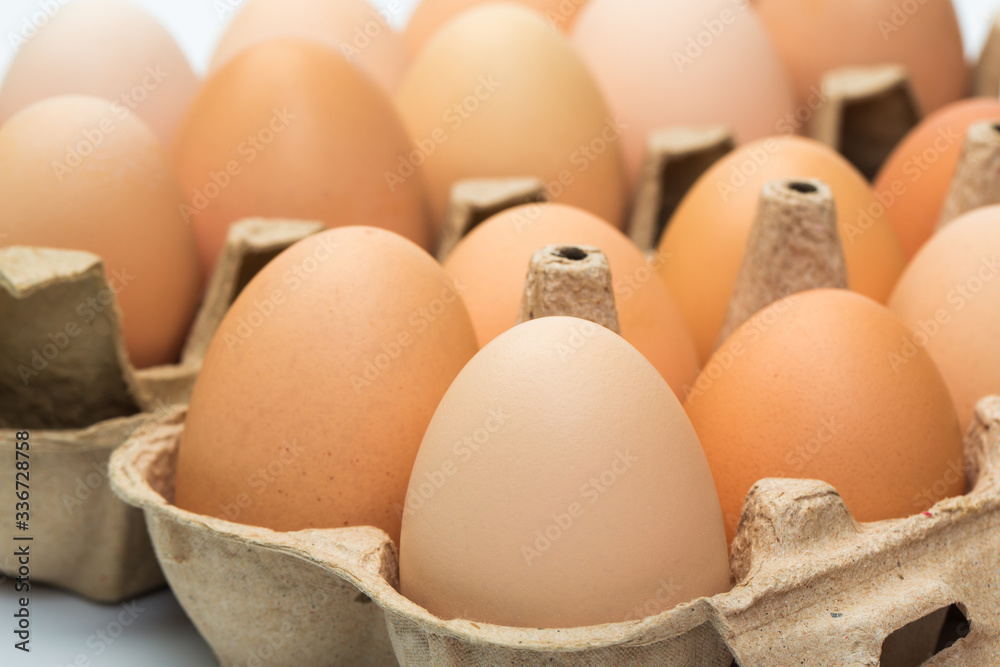 chicken eggs in an open cardboard box with eggs. Fresh chicken eggs background. close-up chicken eggs in an open cardboard box with eggs. Fresh chicken eggs background. close-up