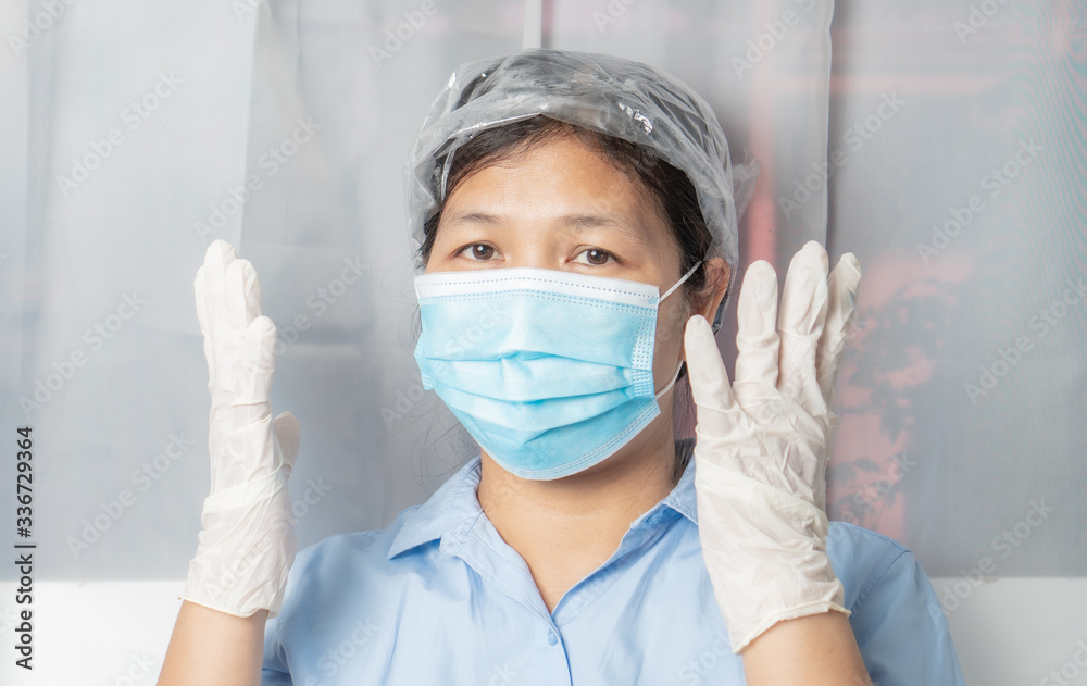 Naklejka premium Asian women wear medical masks, medical gloves, before leaving the house. , To prevent coronavirus, covid-19