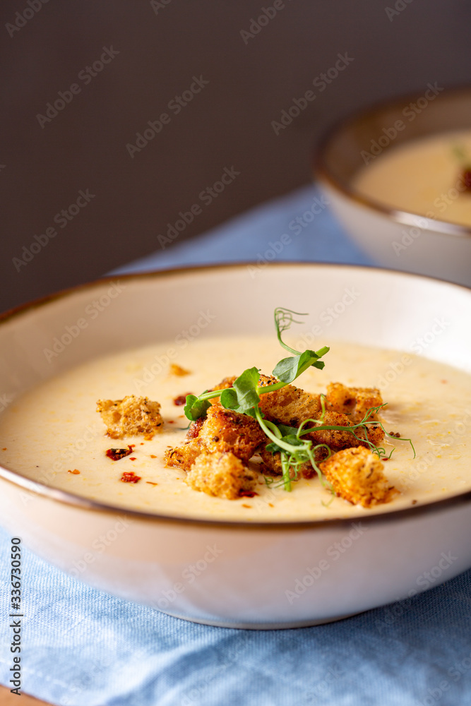 Sweet corn cream soup with croutons