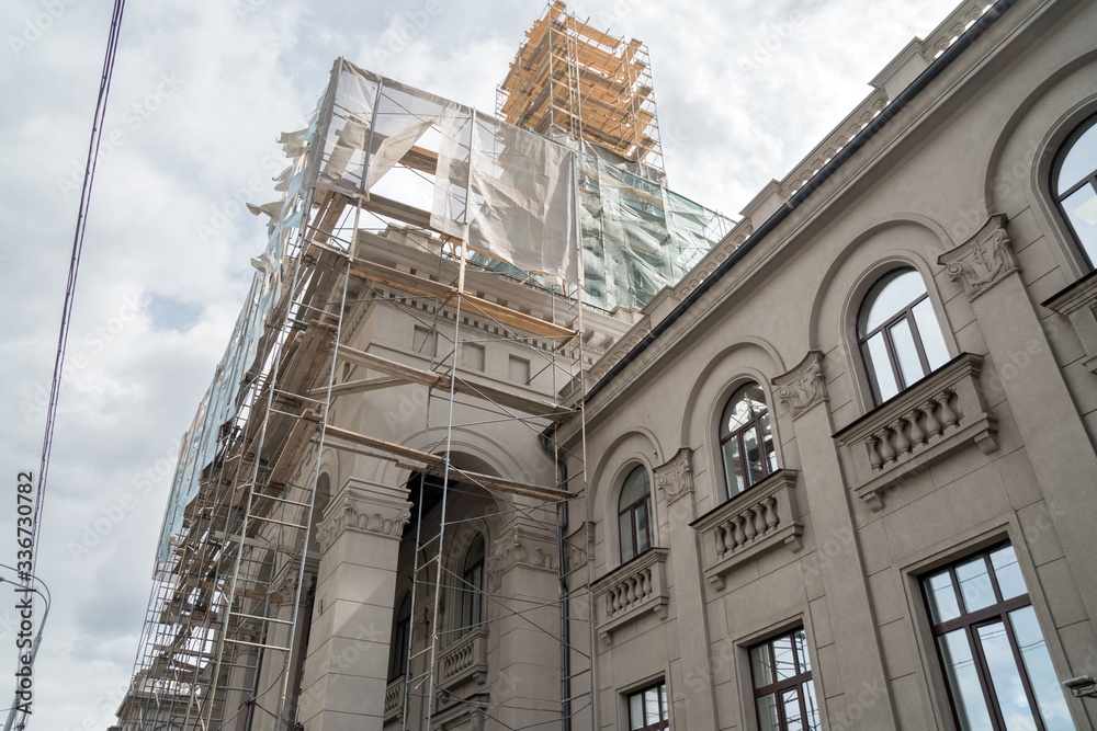 Fototapeta premium Scaffolding on the spire of the river station building (1952) during restoration. Krasnoyarsk Russia.