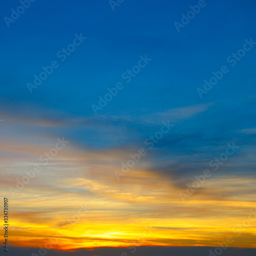 Cloudy sky and bright sunrise over the horizon.