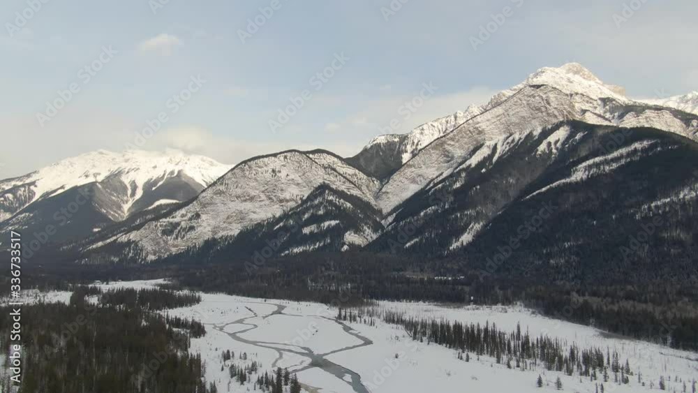 Beautiful Aerial Drone View of Canadian Mountain Landscape during a vibrant winter day. Taken near Golden, British Columbia, Canada. Beautiful Aerial Drone View of Canadian Mountain Landscape during a vibrant winter day. Taken near Golden, British Columbia, Canada.