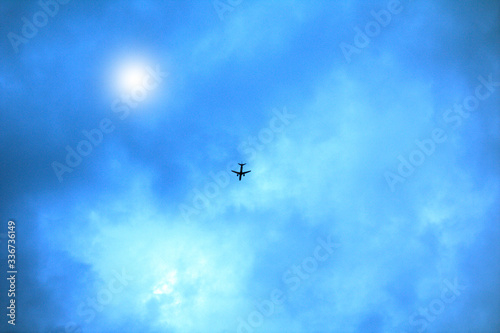 airplane in the sky,fly, clouds,flying, blue,aircraft,travel, transportation,air, sun,jet, © Daniele