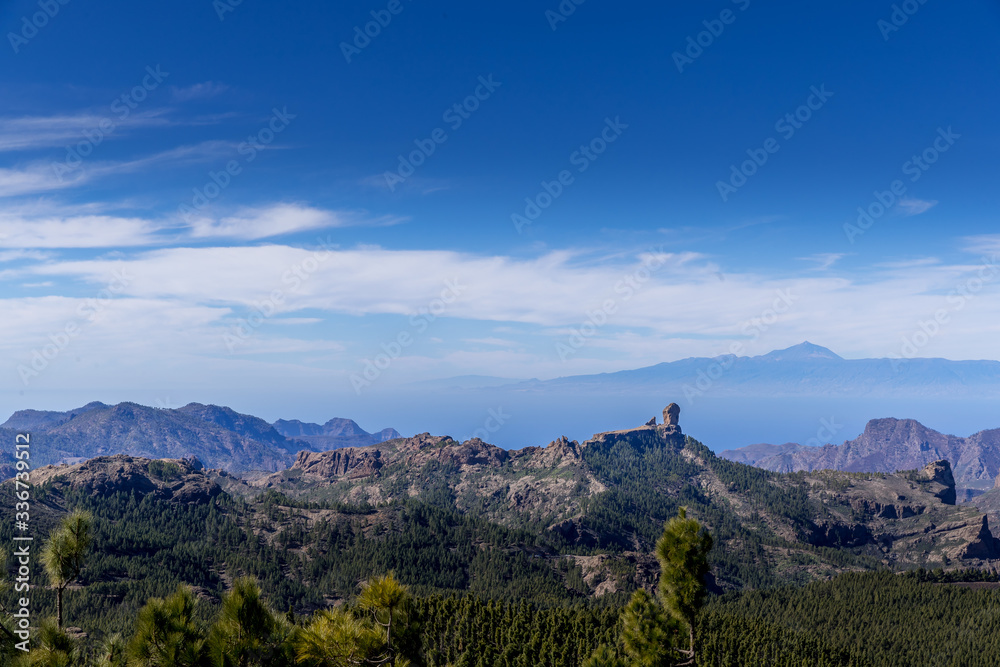 View of the tops of mountain ridges hills and rocks lining the landscape into the distance rises the ridges in the Canary Island National Park