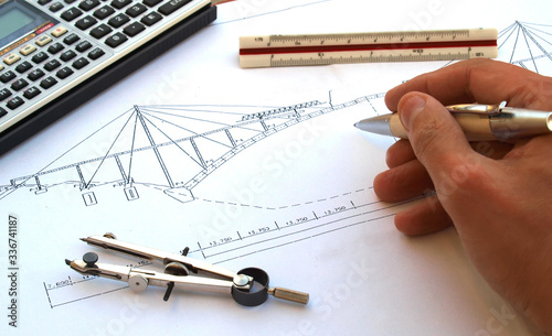 engineer working on a bridge sketch