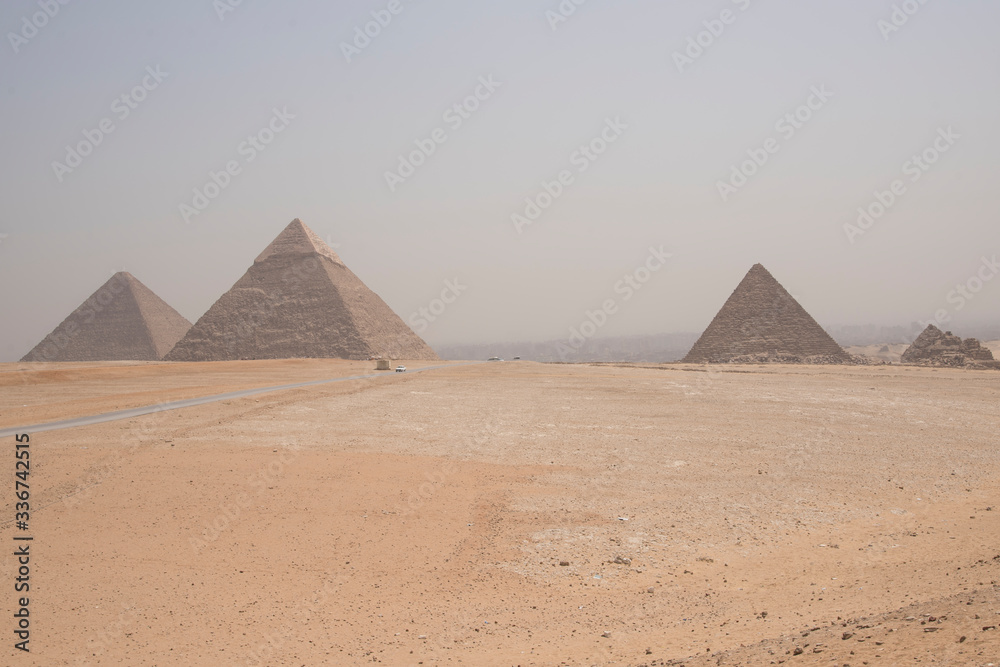 Giza pyramids, next to Cairo in Egypt, Africa. Huge and historic buildings.