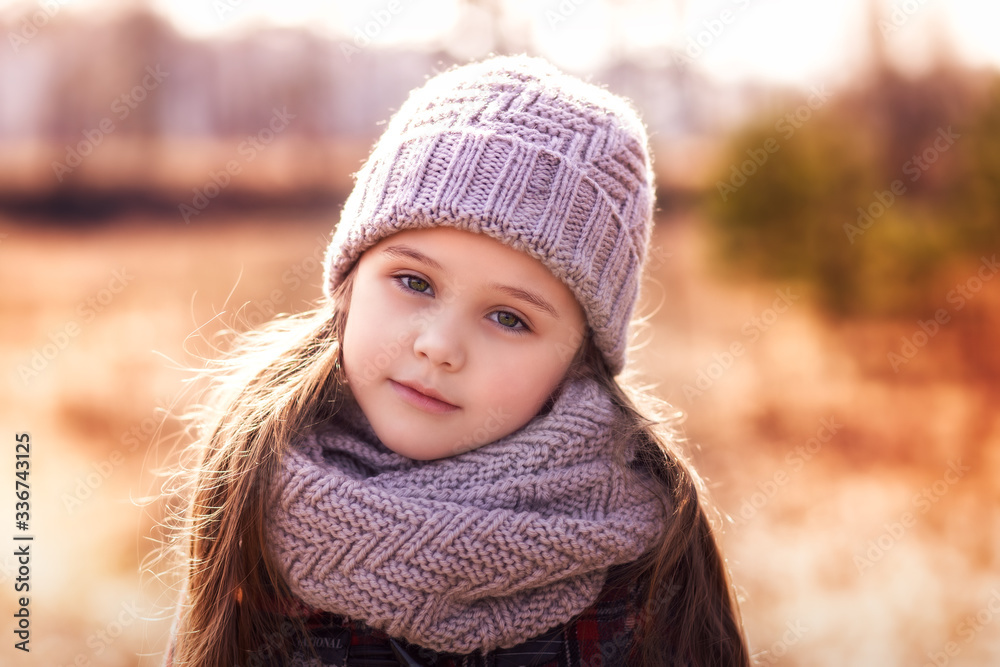 portrait of a little girl in a hat in the spring forest portrait of a little girl in a hat in the spring forest