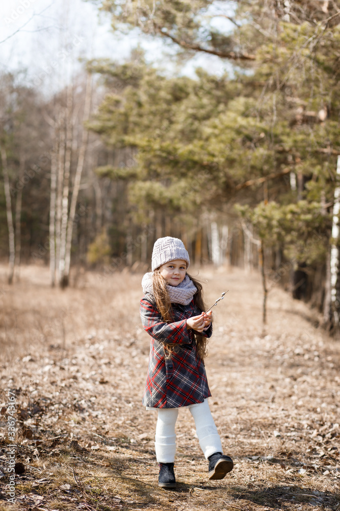 little girl on a forest path in spring little girl on a forest path in spring