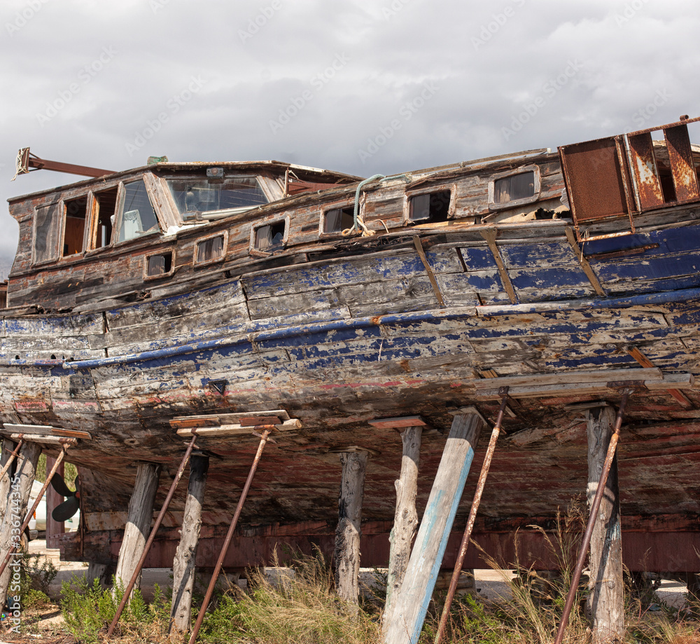 Fototapeta premium old, rusty ship abandoned on the shore.
