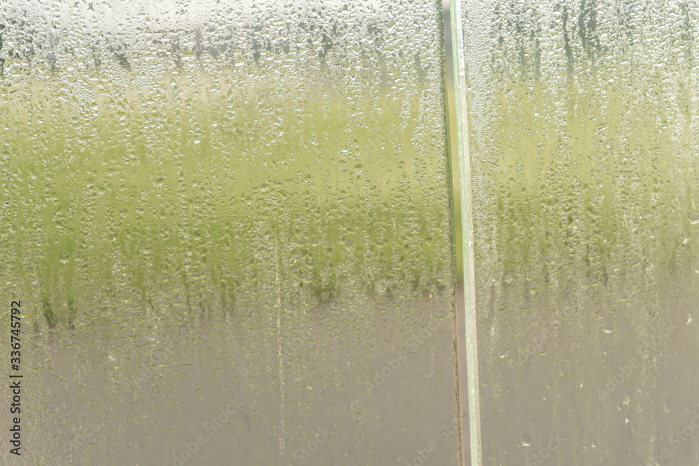 Blurred natural water drop window textured glass . Blurred natural water drop window textured glass .