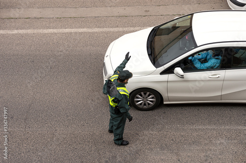 Guardia Civil stops a vehicle at a checkpoint during the Covid-19 pandemic photo