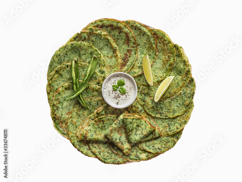 Isolated spinach Adai - Indian green pancakes photo