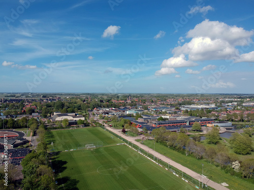 Drone Aerial view of of soccer fields and the buildings of the village of Grootebroek, which is part of urban planning. Photo make with a drone