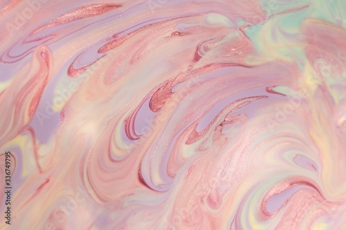 Abstract background of mixed shades of nail polish with a shiny